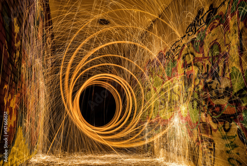 Steel wool vortex spiral light painting in the tunnel