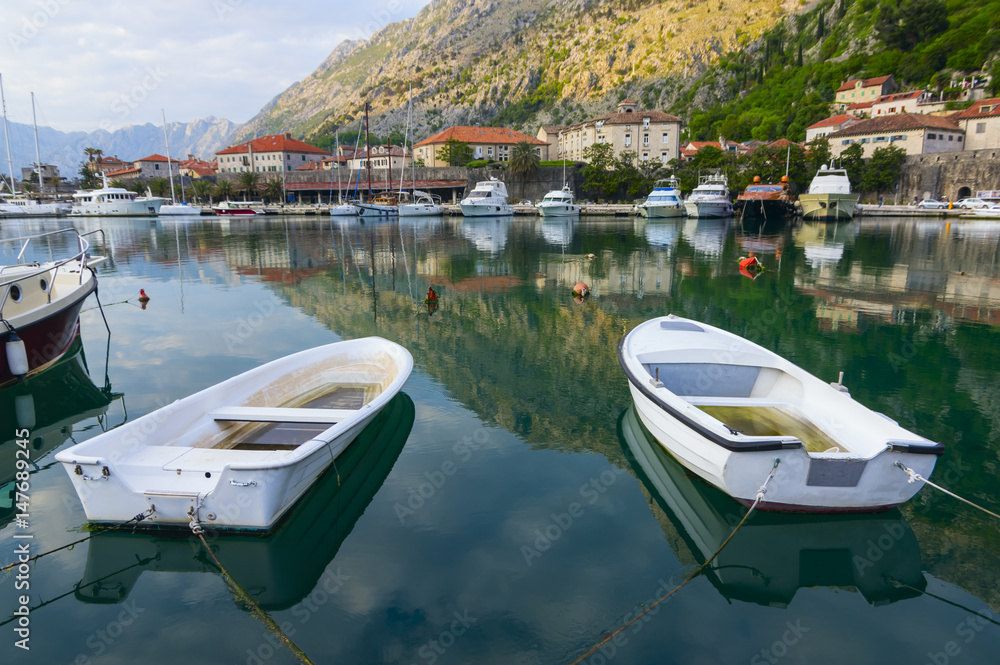 Evening landscape with moored boats in Kotor Bay, Montenegro