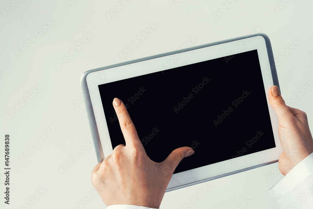 Close of female doctor hands working with tablet pc computer Close of female doctor hands working with tablet pc computer