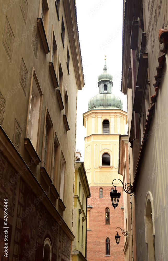 Fragment of the narrow street. Architecture of the old city of Warsaw. Poland.. Fragment of the narrow street. Architecture of the old city of Warsaw. Poland..