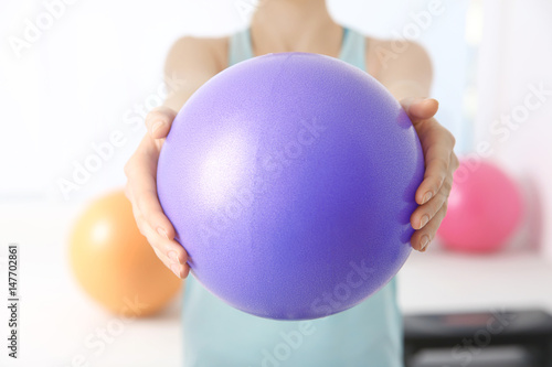 Woman with rubber ball in c...