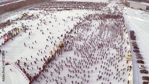 People participating in the mass ski race Ski Track of Russia during the competition. competition skiing, the crowd. a large number of people taking part in the competitions on the slopes photo