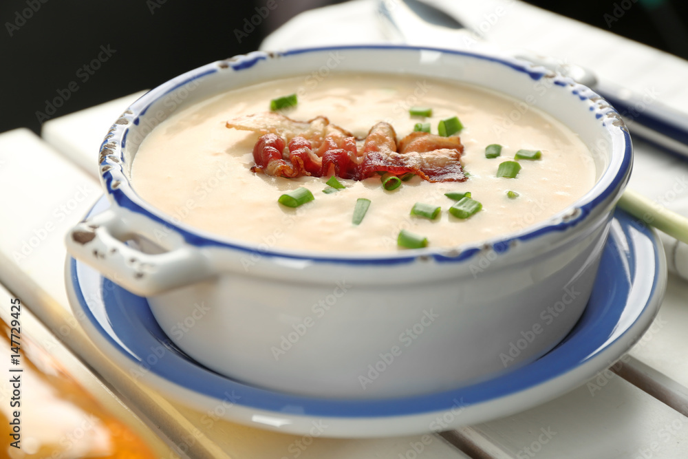 Delicious cream soup with bacon and onion, closeup Delicious cream soup with bacon and onion, closeup