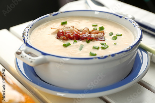 Delicious cream soup with bacon and onion, closeup