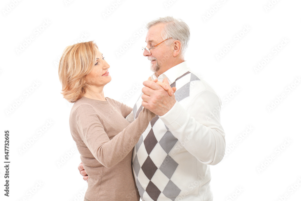 Happy senior couple dancing on white background Happy senior couple dancing on white background
