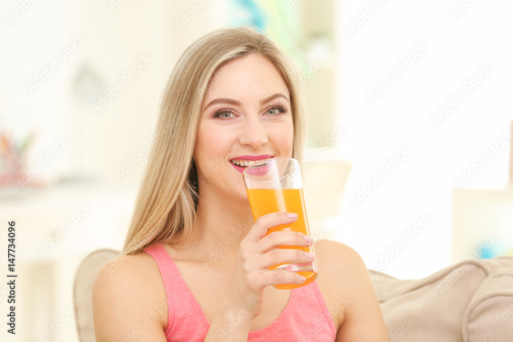 Beautiful young woman drinking fresh juice at home Beautiful young woman drinking fresh juice at home