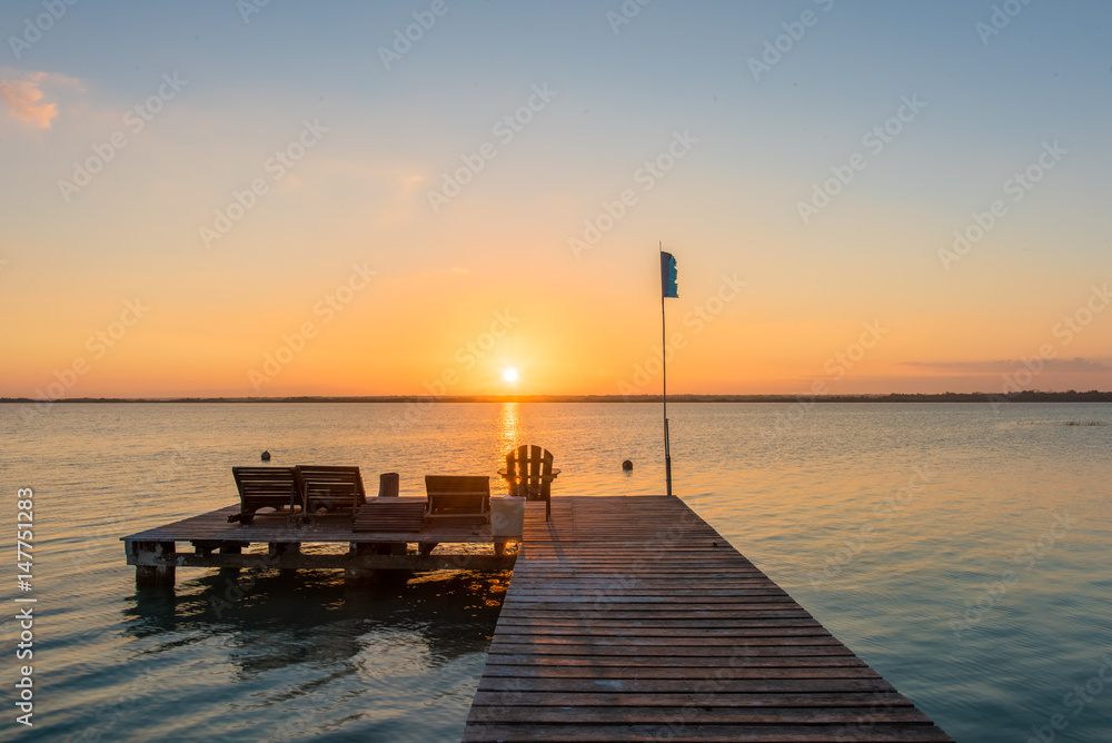 Sunrise on the boardwalk in Bacalar, Mexico