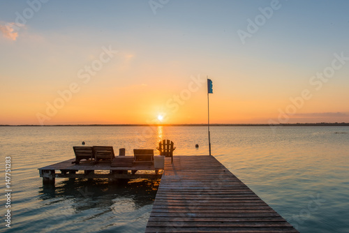 Sunrise on the boardwalk in Bacalar, Mexico