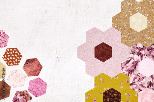 Abstract background of hexagonal pieces of fabric Grandmother's Flower Garden quilt