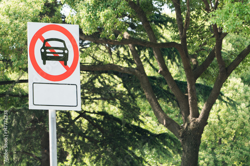 prohibited no parking car road sign on the tree background