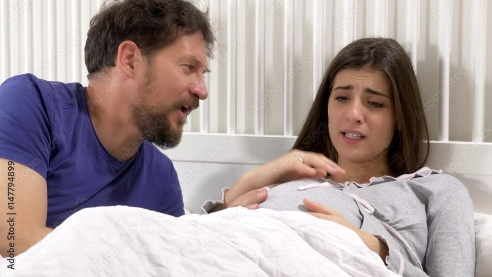 Man getting scared of pregnant woman contractions screaming Man getting scared of pregnant woman contractions screaming