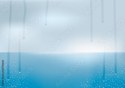 結露　曇り空と海　窓からの風景