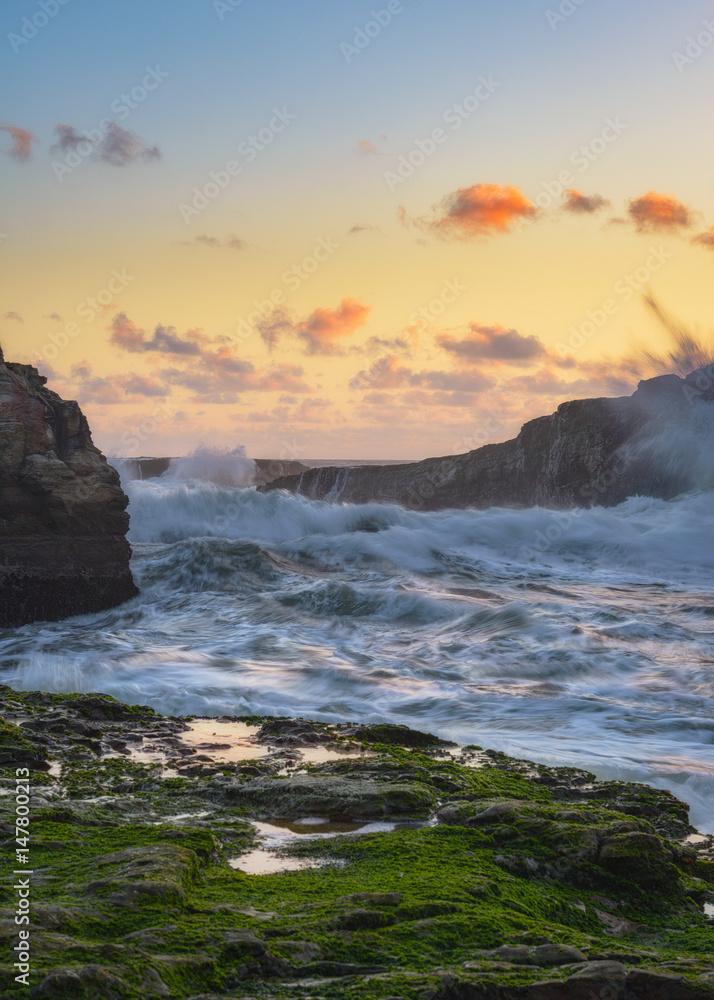 Sunset colors over ocean waves