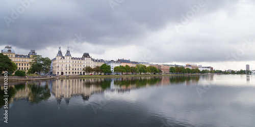 Waterfront city buildings along the canal in Copenhagen, Denmark. Copenhagen city panorama in summer.