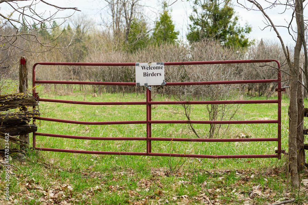 Red metal gate for birders