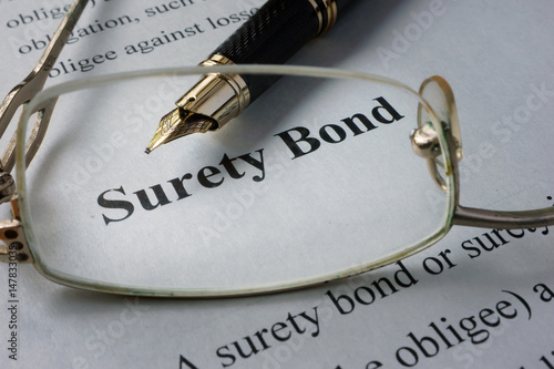 Page of newspaper with words surety bond.   photo