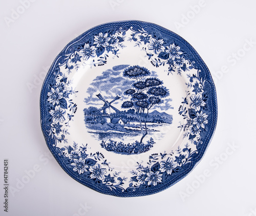 plate or flowers on plate painted by hand on background.