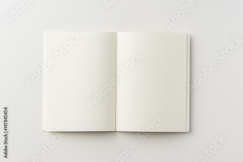 Business concept - Top view of blank notebook on white background desk for mockup