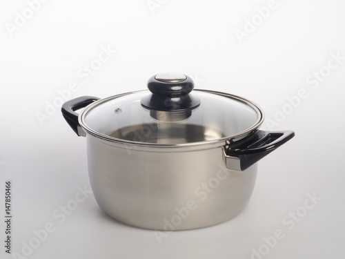 pan or stainless steel pan on background.