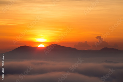 Landscape with sunrise over the mountain,misty morning in Thailand.