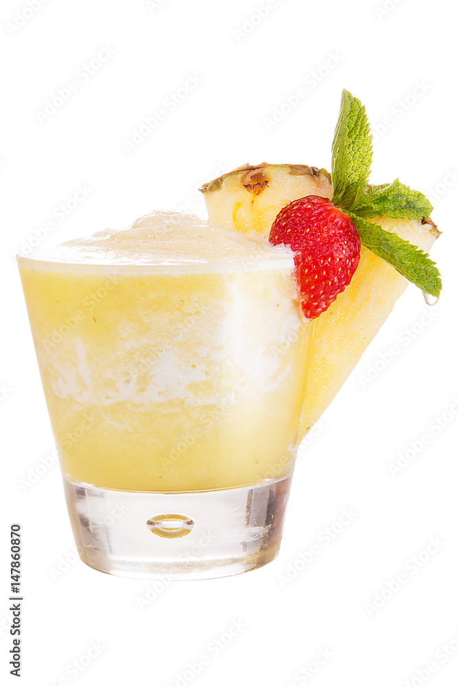 A refreshing fruit cocktail. Refreshing pineapple drink, decorated with a slice of pineapple and mint A refreshing fruit cocktail. Refreshing pineapple drink, decorated with a slice of pineapple and mint