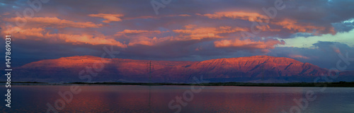 Sunset at the Dead Sea overlooking the mountains of Jordan © Ilgonis