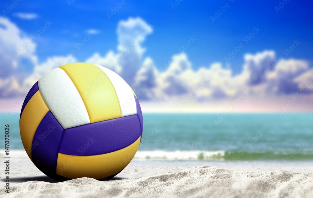 Volleyball on the beach with open sea and cloudy blue sky