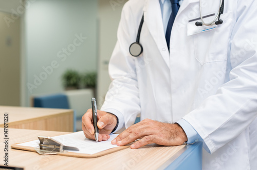 Doctor examining medical report