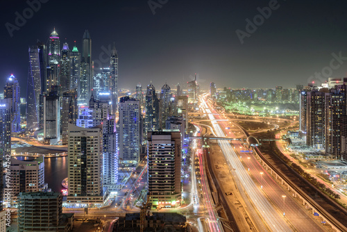 Scenic view from roof top of Dubai's Jumairah Lakes Towers (JLT) by night © kingslyg