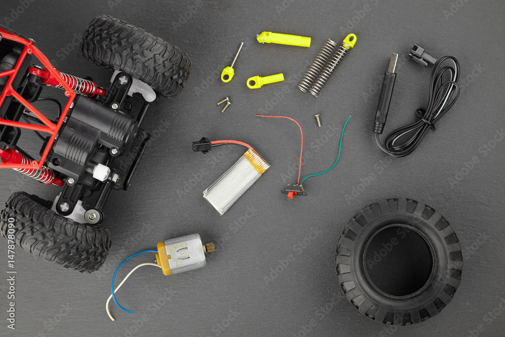 Various parts for radio-controlled models on a dark background top view Various parts for radio-controlled models on a dark background top view