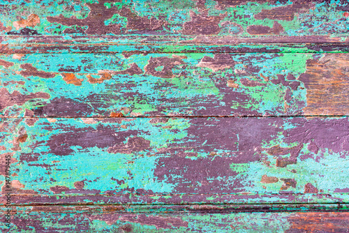 Abstract grunge wood planks texture background with peeling blue paint