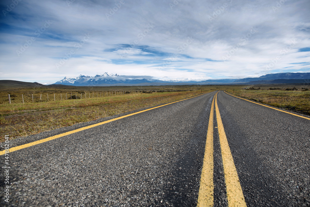 Fototapeta premium Highway leading to Torres del Paine National park, Chile's most famous park outside Puerto Natales in Patagonia region