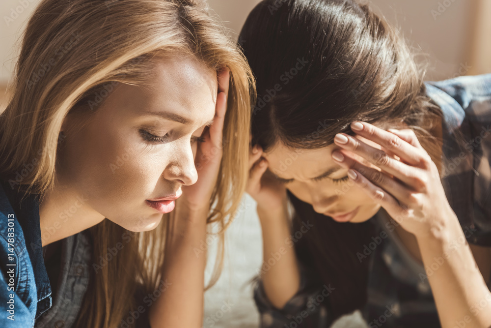 Fototapeta premium women lying on floor with headache