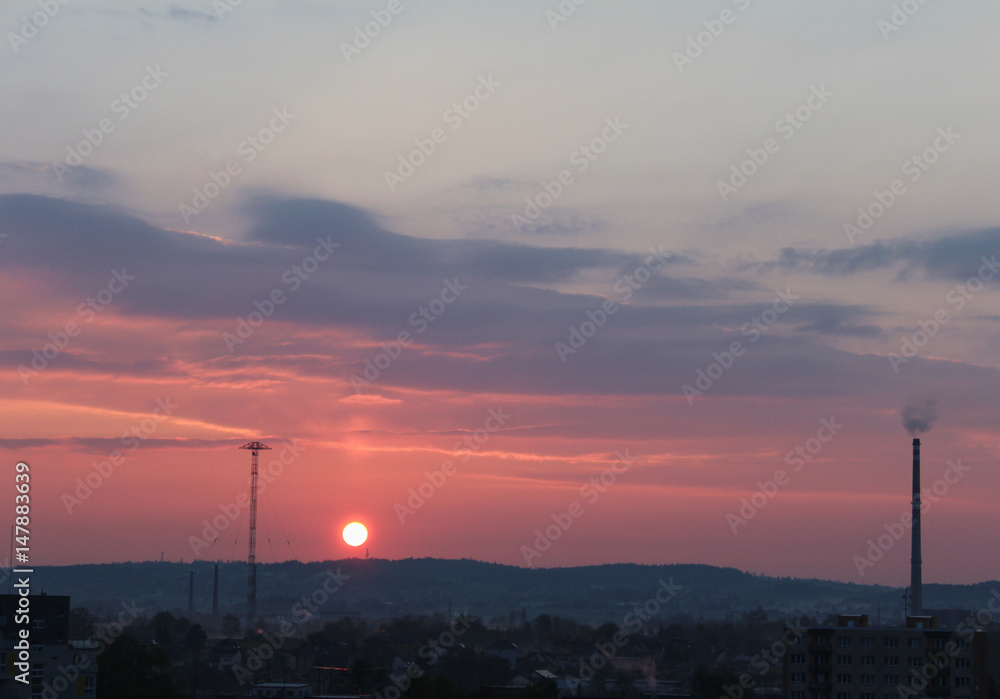 Sunrise with warm clouds over city Ceske Budejovice