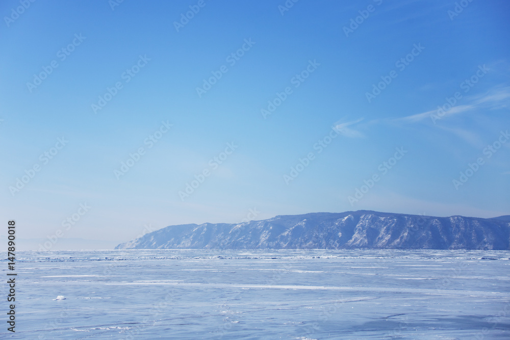 Lake Baikal ice. Blue sky. Winter landscape