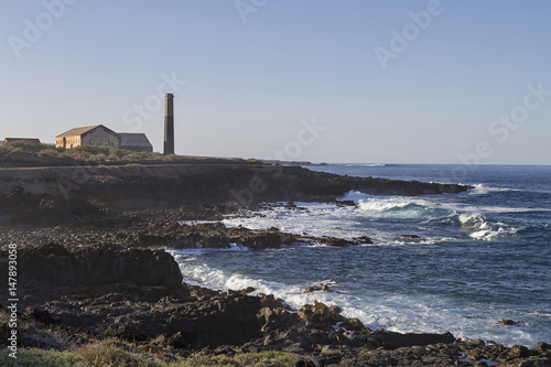 Seascape in Tenerife island with an old factory