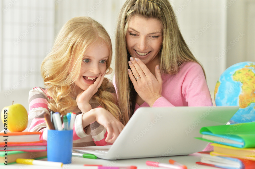Mom and daughter doing lessons Mom and daughter doing lessons