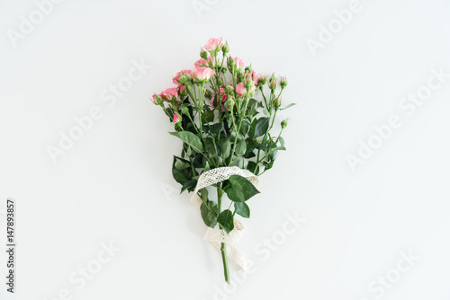 pink roses bouquet with ribbon isolated on white with copy space  wedding flowers bouquet concept