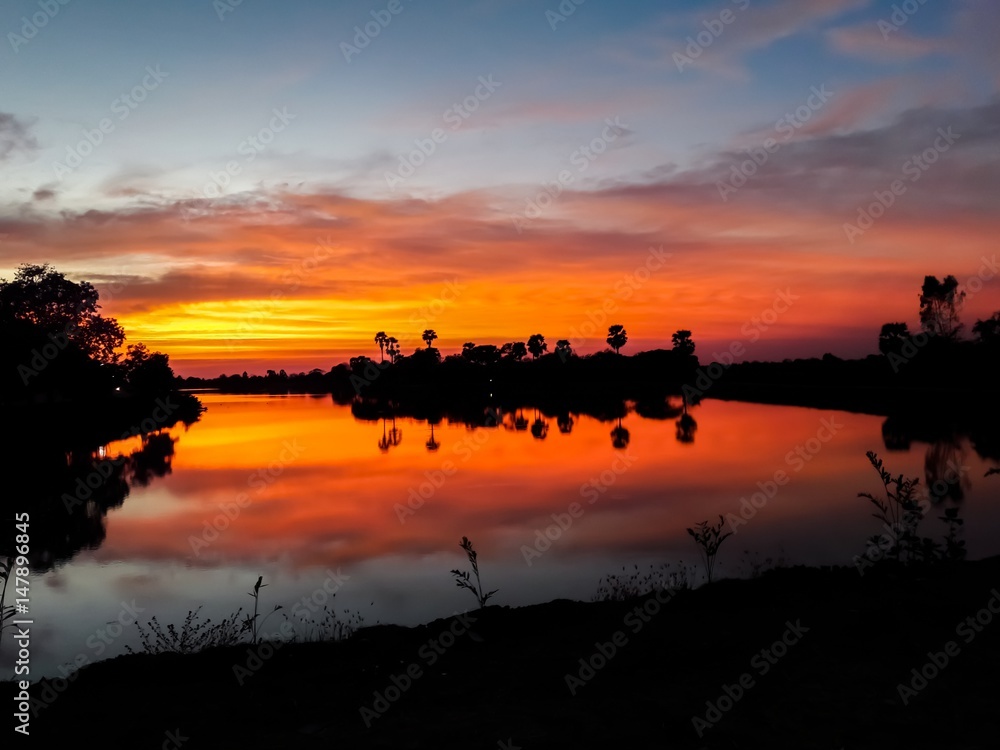 Sunset behind the pond Sunset behind the pond