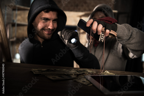 Photography Robbers stealing money