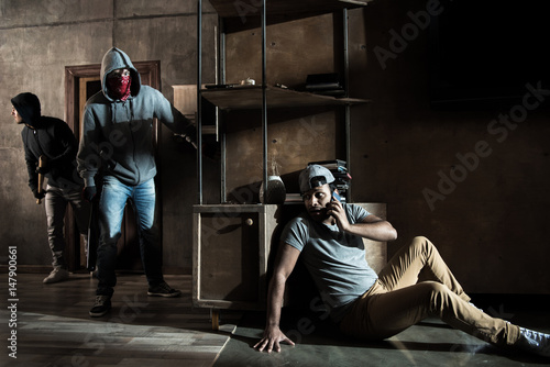 Burglars and scared man