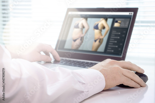 Tableau sur toile Professional photo editor retouching an image of a woman