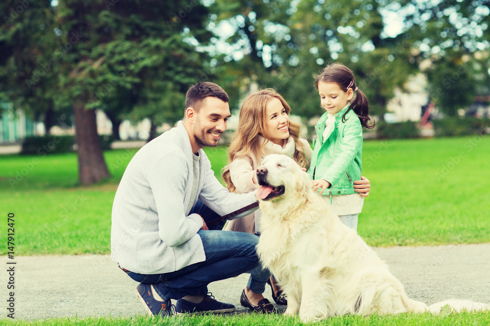 happy family with labrador retriever dog in park happy family with labrador retriever dog in park