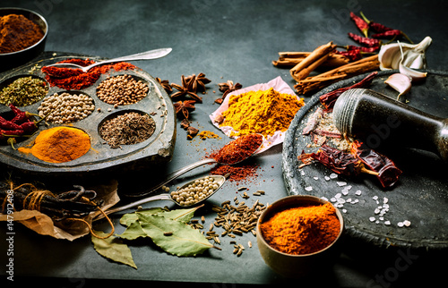 Fototapeta Naklejka Na Ścianę i Meble -  Preparing ground spices for Asian cuisine