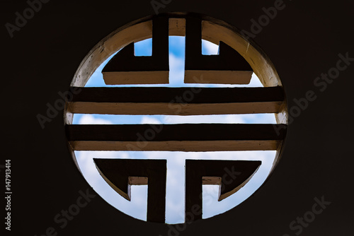 Chinese window style with low light and blue sky