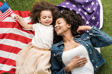 woman with daughter on american flag