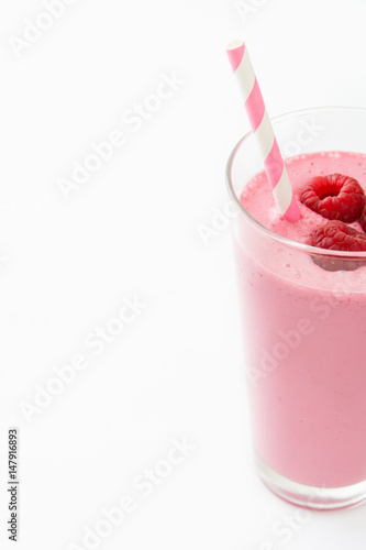 Raspberry smoothie in glass isolated on white background
