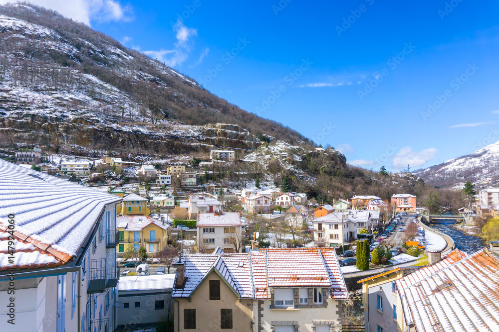 Apartments and hotel of French mountain ski resort in summer sunny day, Ax-les-Thermes, France