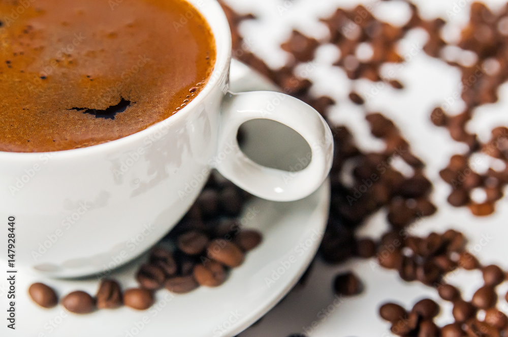 Coffee cup and beans on a white background. Coffee cup and beans on a white background.