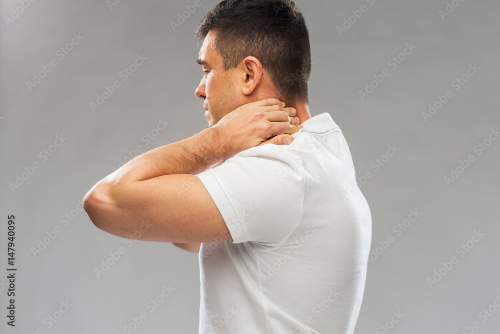 close up of man suffering from neck pain close up of man suffering from neck pain
